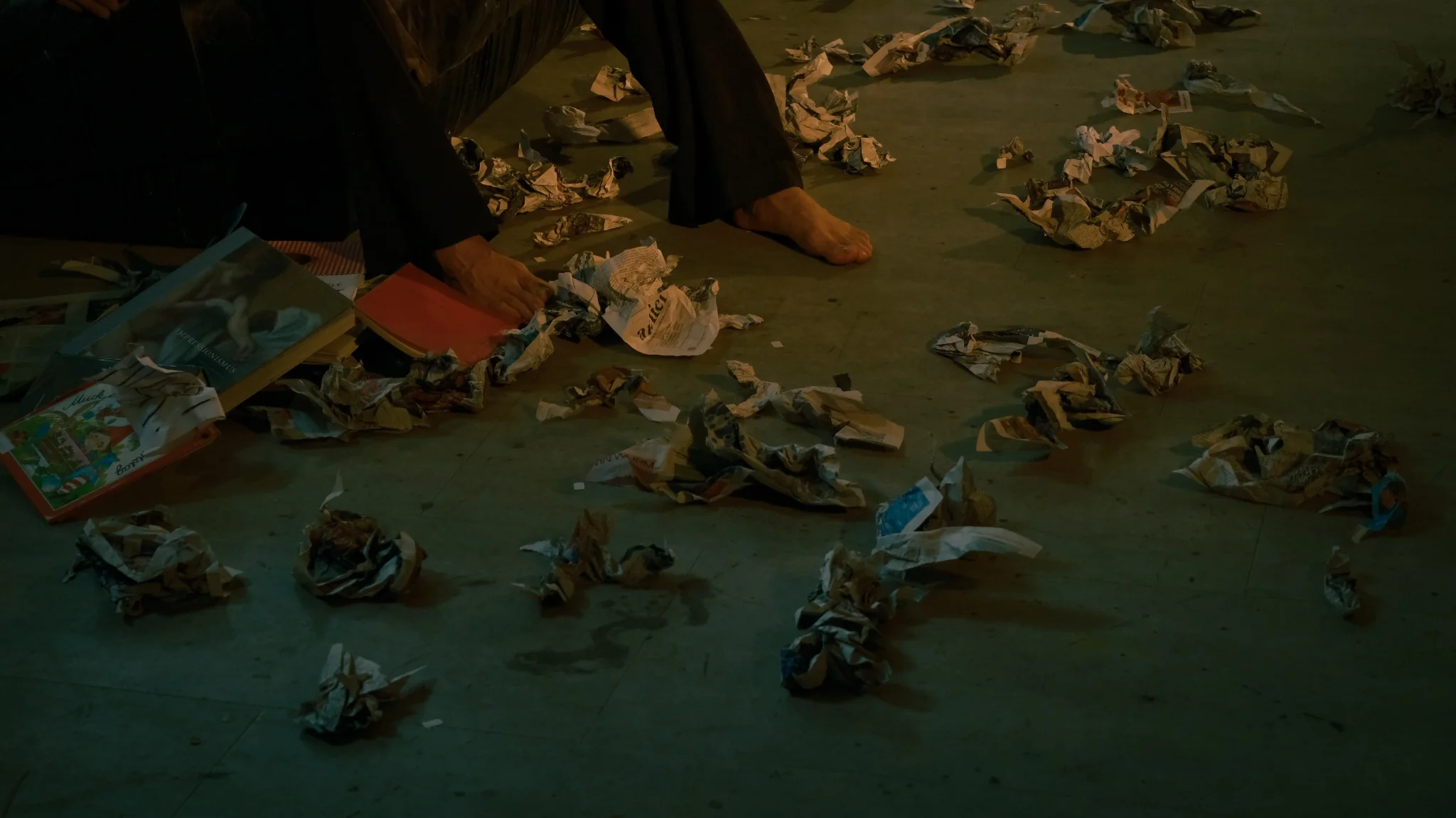 Performance detail with books and paper