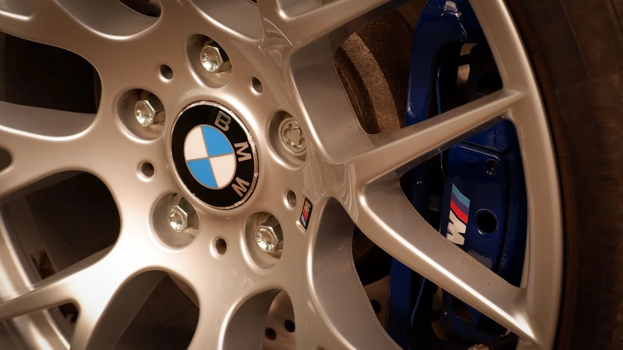 Close-up of a BMW M wheel and blue brake caliper