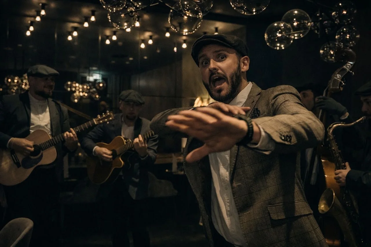 Peaky Voices singer reaching toward the audience during an intimate live performance